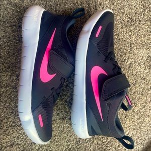 BRAND NEW pink and black running NIKE shoes